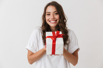 Portrait of an excited young casual brunette woman