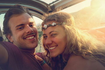 Couple in a car at sunset