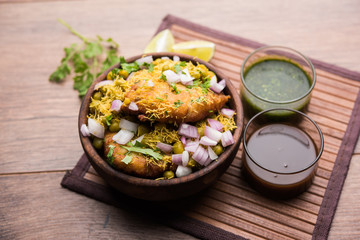 Ragda Pattice is a popular Street food or chat made of potato Patties. served in a steel plate, bowl or ceramic plate with tamarind and cilantro chutney