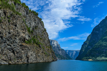 Incredibly high rocky shores of the fjord. Neroyfjord offshoot of Sognefjord is the narrowest fjord in Europe. Norway.