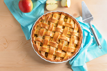 Delicious apple pie on wooden background