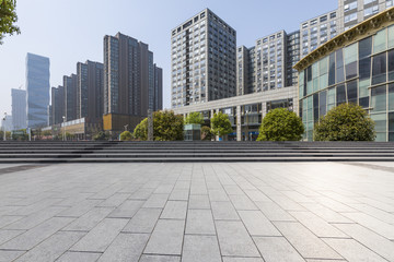 Panoramic skyline and modern business office buildings with empty road,empty concrete square floor