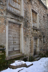 Fototapeta na wymiar A street in the hill village of Casso in winter Friuli Venezia Giulia, north east Italy. 