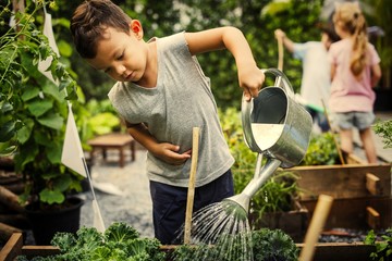 Kids learning how to farm and garden - Powered by Adobe