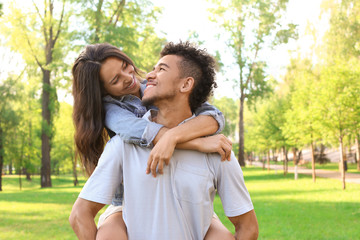 Fototapeta premium Happy African-American couple in park on spring day