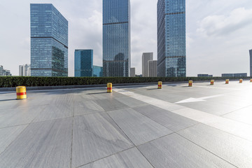 Panoramic skyline and modern business office buildings with empty road,empty concrete square floor