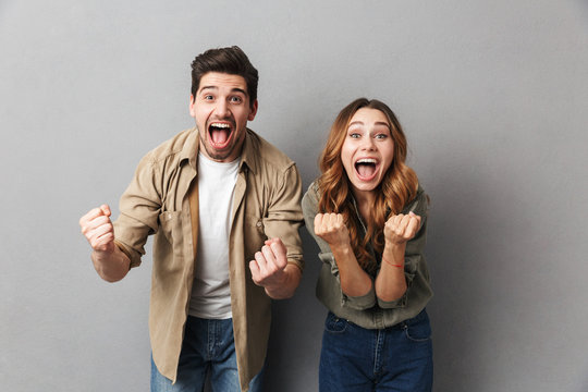 Portrait of a happy young couple screaming