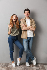 Full length portrait of a cheerful young couple