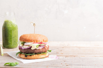 Veggie bean and quinoa burger with fresh vegetables. Copy space