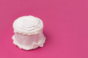 Jewelry box handmade of white color. Closed box for wedding rings.Gift box is decorated with a lace, a flower and a bow of fabric.