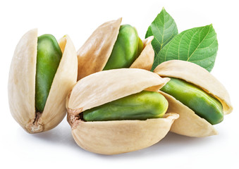 Green pistachio nuts with pistachio shell on white background.