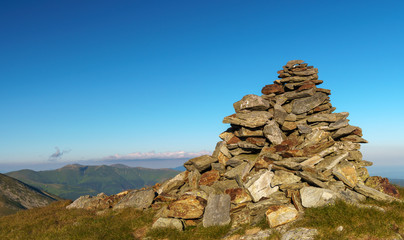 Stack of rocks marking a mountain peak