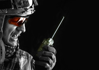 military man with portable radio transceiver