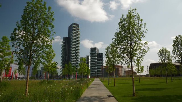 milan city day time famous modern block park slow motion panorama 4k italy
