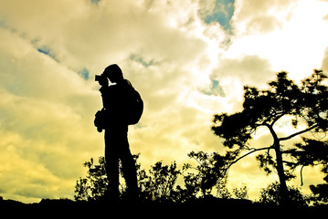 silhouettes photography on mountain, in sunset