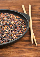 Black rice in pan