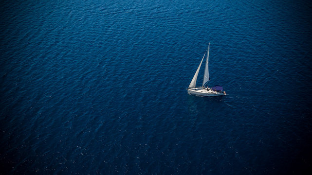 Fototapeta Sailing boat on open water, aerial view