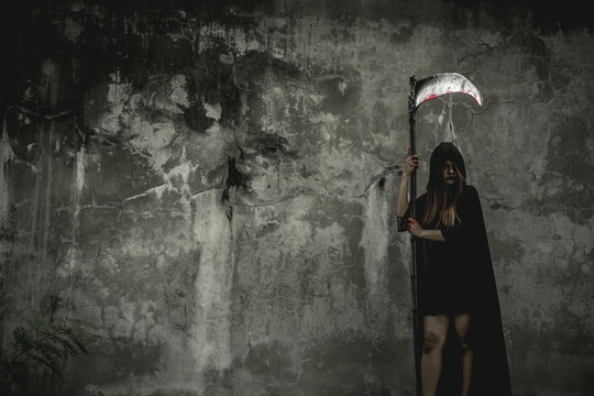 Girld dress black as angel of death and kira angkor in Halloween festival. Halloween concept. Psychopomps.