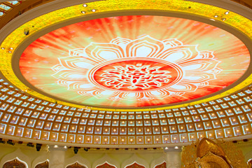 the Centre of Buddhism in Sanya. Temple with Lotus on the ceiling, Golden Buddha and many statues...