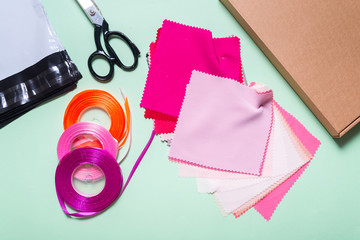 Textile Fabric and Ribbon on dressmaker work table
