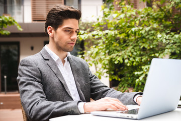 Confident young businessman dressed in suit