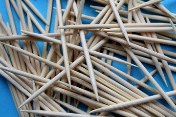 wooden sharp toothpicks scattered on the table