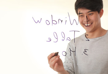 Young man giving presentation during business meeting in office