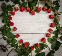 background. beautiful red roses in the form of heart on a white wooden background. mothers Day. Valentine's Day. new Year. Christmas.