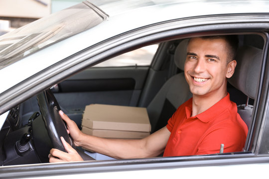 Pizza Delivery Man Driving A Car