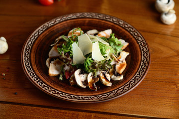 salad with meat, champignons and parmesan cheese