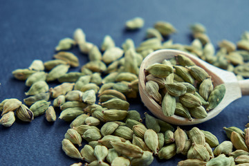 Super food cardamom health food selection in spoon.