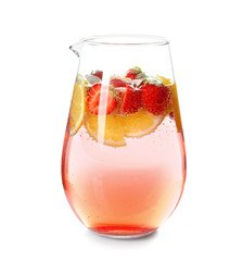 Tasty lemonade with strawberry in glass jug on white background