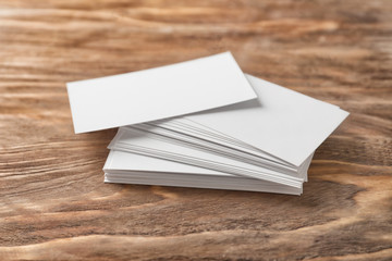 Blank business cards on wooden background