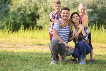 Fototapeta premium Happy family in park on summer day
