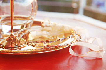 still life photography of traditional wedding crowns, decanter and chalice - greek wedding objects