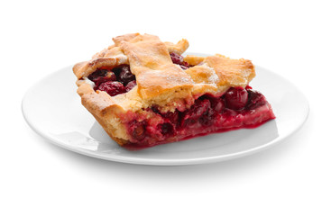 Plate with piece of delicious cherry pie on white background