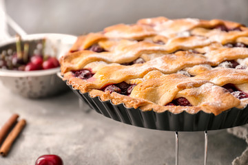 Delicious homemade cherry pie on table