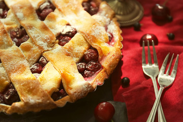 Delicious homemade cherry pie on table