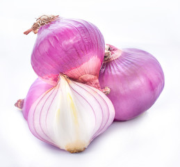 Slices of shallot onions for cooking on white background.