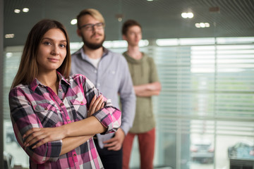 3 people work in the office, talking to, and address the issues of the company, smile and sign documents