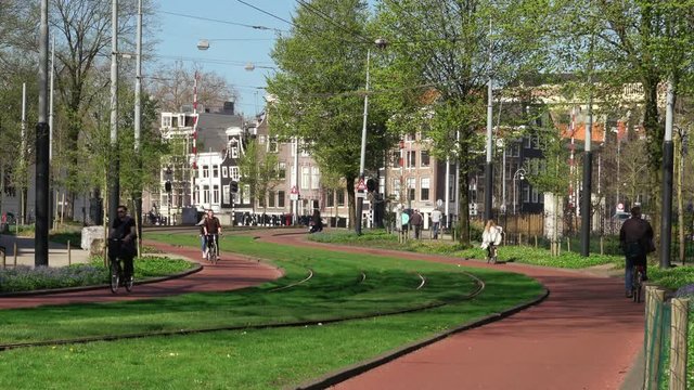 Amsterdam,01/06/2018:people riding bicycle on bike path 