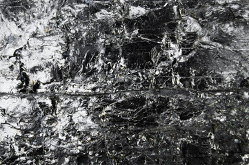 Abstract burn background. Black coal with sparkles