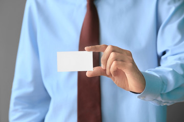 Man with business card, closeup