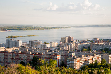 Saratov, Russia, view of the houses, the Volga River, the bridge to Engels. The landscape of the city from a height.