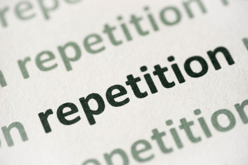 word repetition printed on paper macro