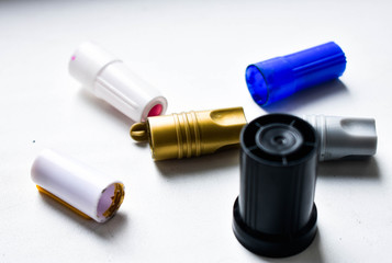 Scattered caps from markers, colorful background, wonderful background