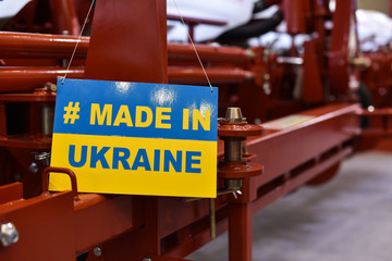 Obraz premium sign of Made in Ukraine on agriculture machine