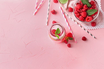 Composition with fresh raspberry mojito on color background