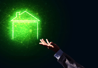 Conceptual image with hand pointing at house or main page icon o