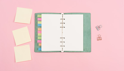 notebook on pink background